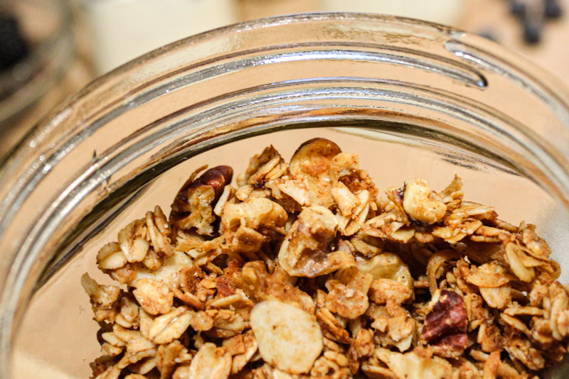 close up of gingerbread granola in a glass jar