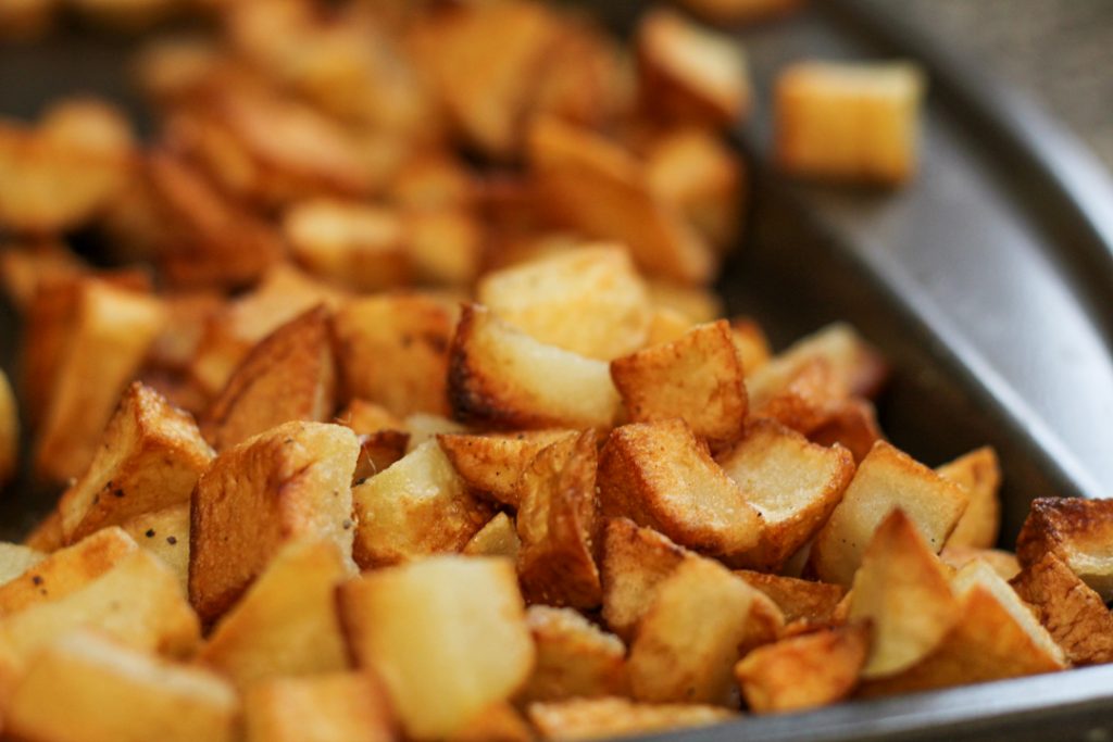 Crispy breakfast potatoes on a baking sheet